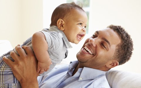 Baby smiles after visiting a children's dental center in Campbell, CA.